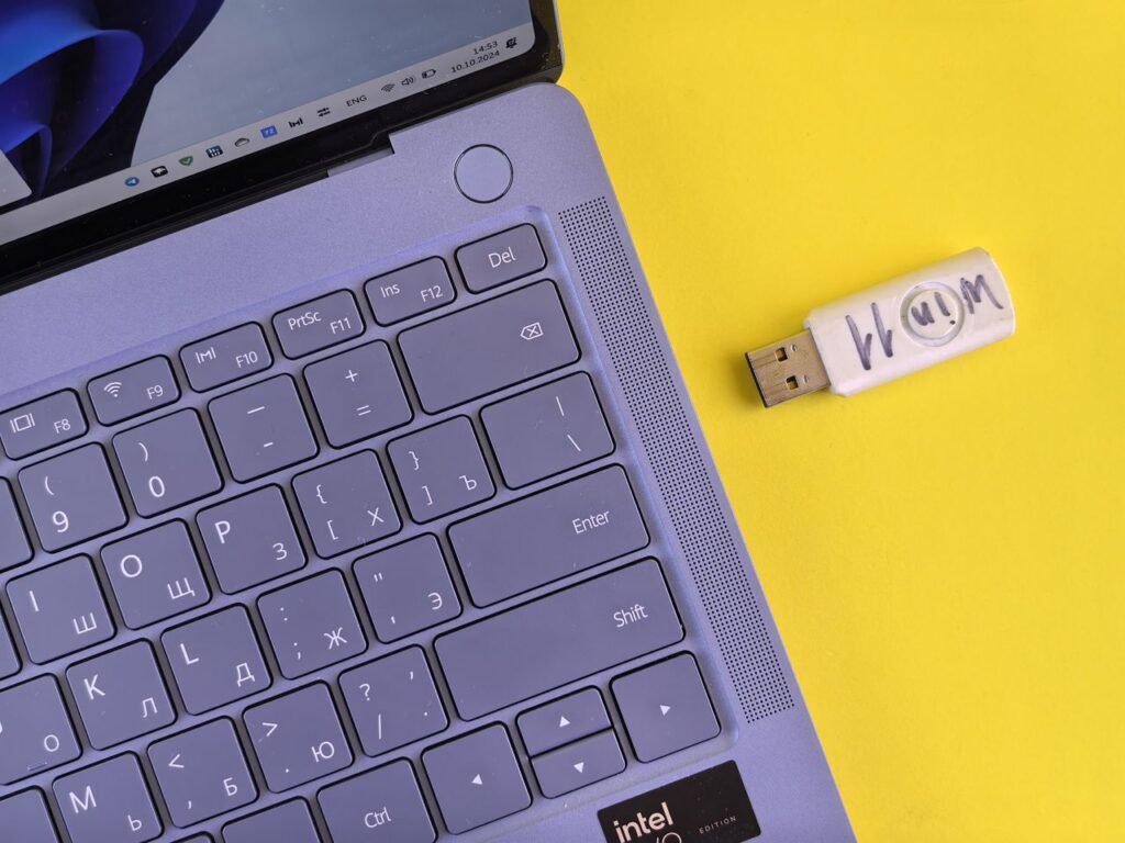 A person using a laptop to speed up Windows 11
